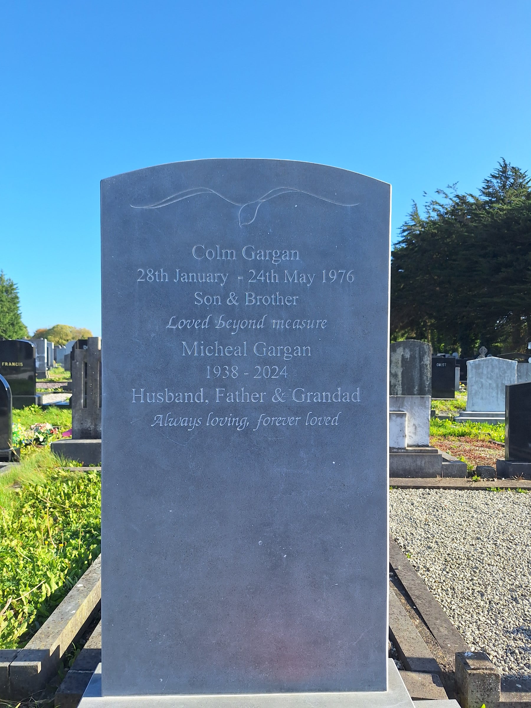 A simple and elegant hand carved headstone by James McLoughlin.