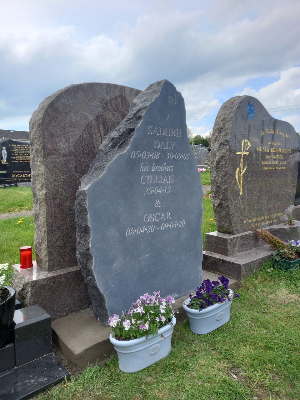 A hand carved headstone that shows off the incredible texture of the stone.