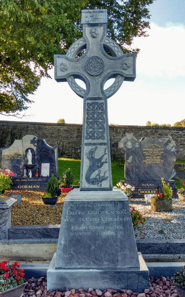 Full view of a hand-carved Celtic cross headstone by Irish sculptor James McLoughlin