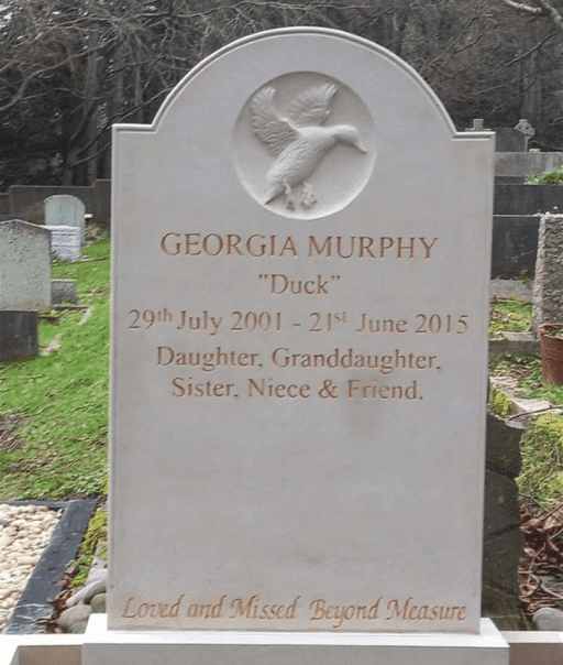 Limestone headstone featuring an engraved duck design by Irish sculptor James McLoughlin.