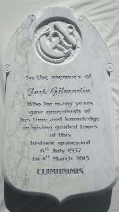 Limestone headstone with a carved anchor motif by Irish sculptor James McLoughlin